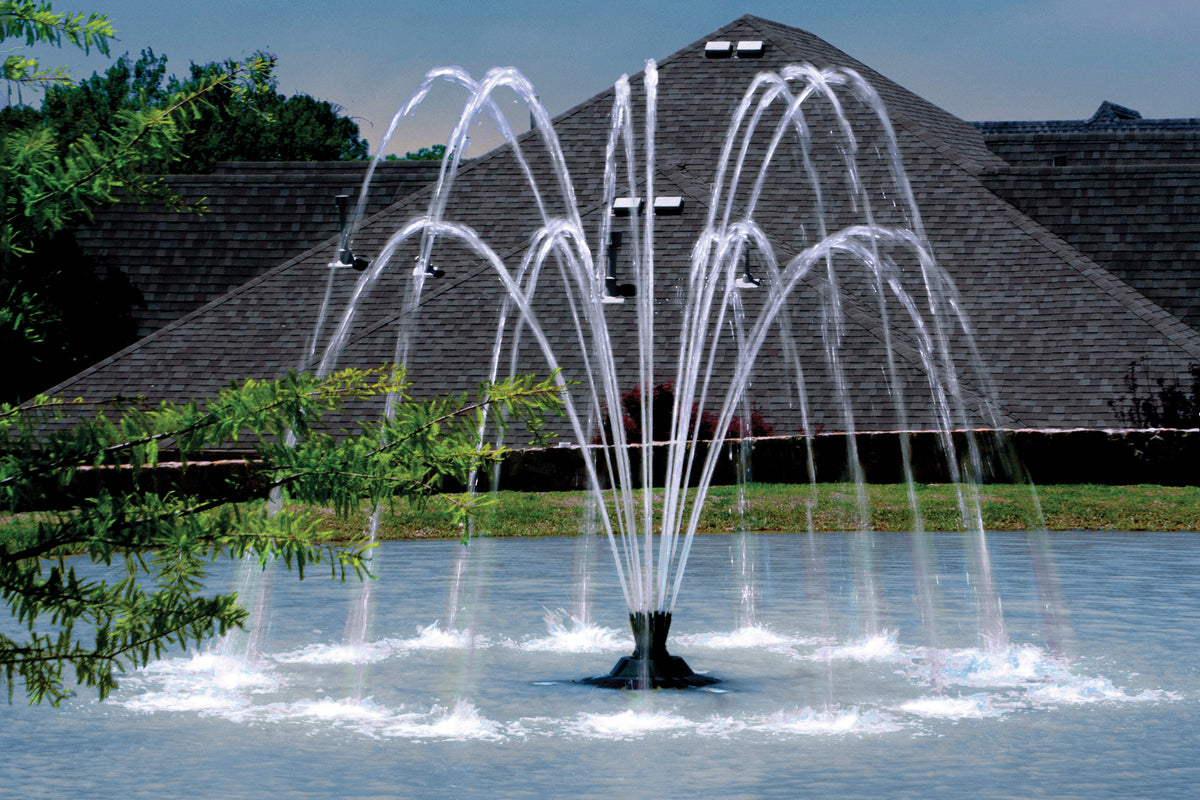 Aqua Control Select Series 2 Weeping Willow fountain spray pattern running on a pond in daylight